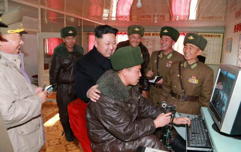 Illustration for article titled Kim Jong Un Visits Female Fighter Pilots, Picks Up Camera For Photo Op